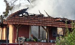 2 torununu alevlerin arasından kurtardı