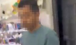 Kırtasiyede genç kızın fotoğrafını çeken şüpheliye tepki